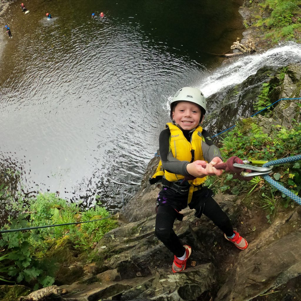 Enjoying The Freefall Abseil Finale At The End Of The Canyon